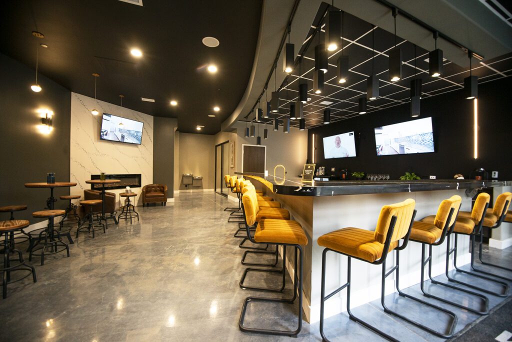 Classic Granite and Marble showroom lounge with modern bar seating, a top result for countertop stores near me